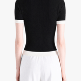 Black shirt worn by a person, showing the shirt fit