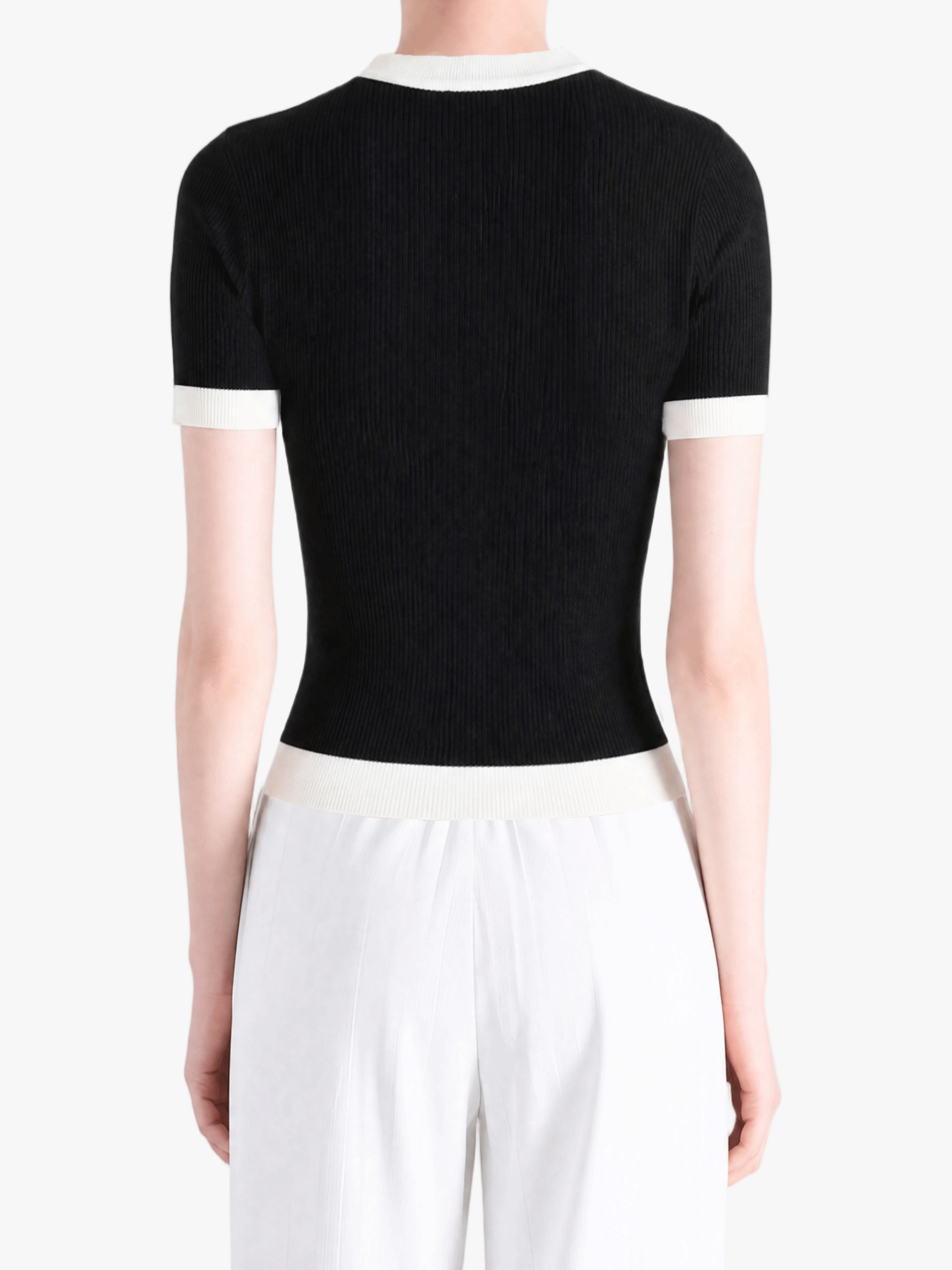 Black shirt worn by a person, showing the shirt fit