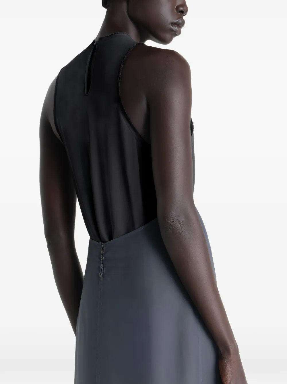Grey dress worn by a person, showing the dress's fit