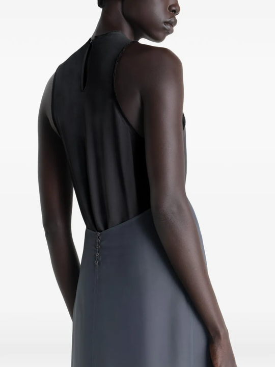 Grey dress worn by a person, showing the dress's fit