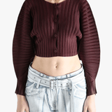 Brown cardigan worn by a person, showing the cardigan's fit