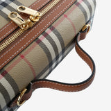 Close up of tan bags, showing texture of the fabric