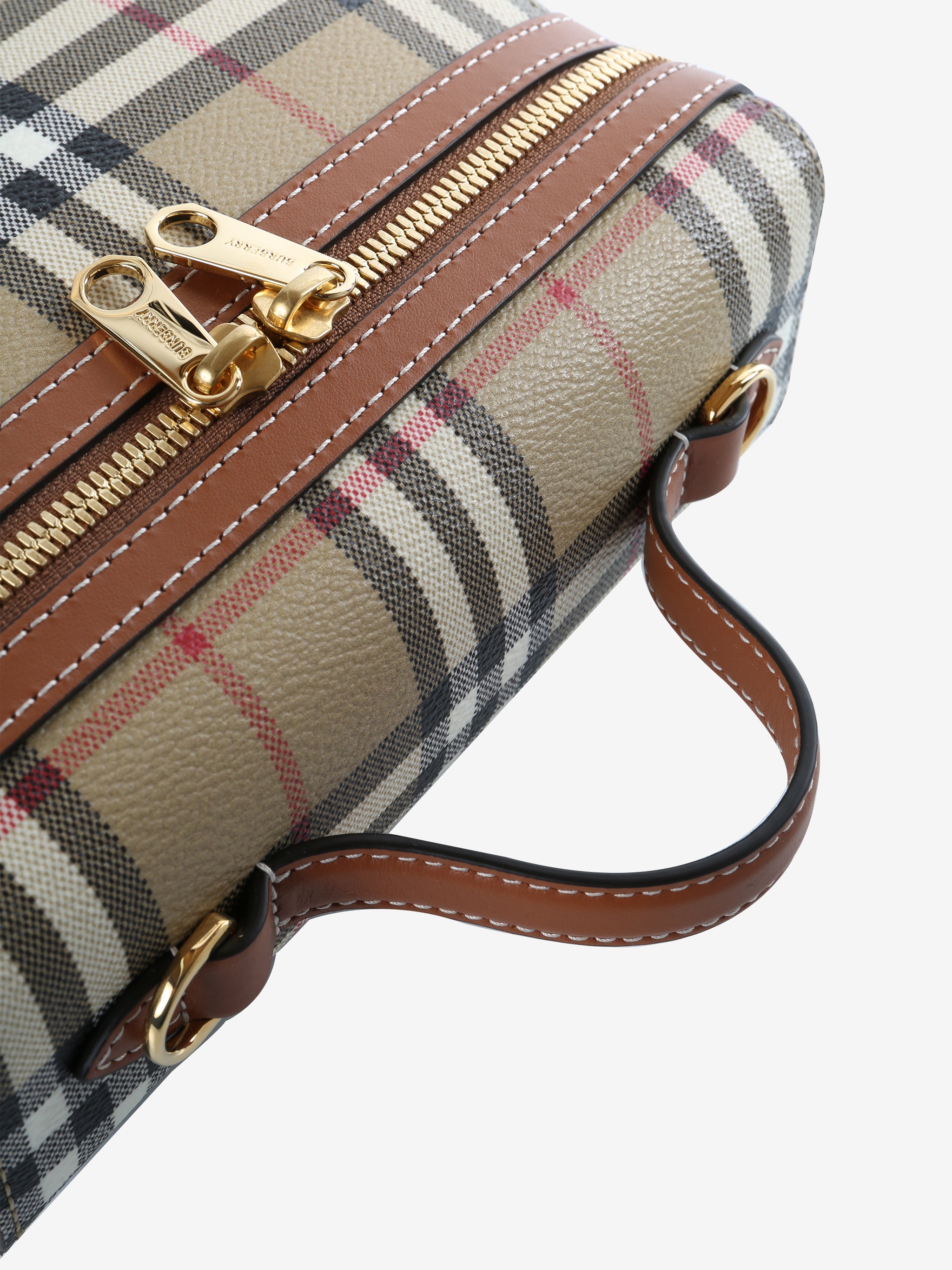 Close up of tan bags, showing texture of the fabric