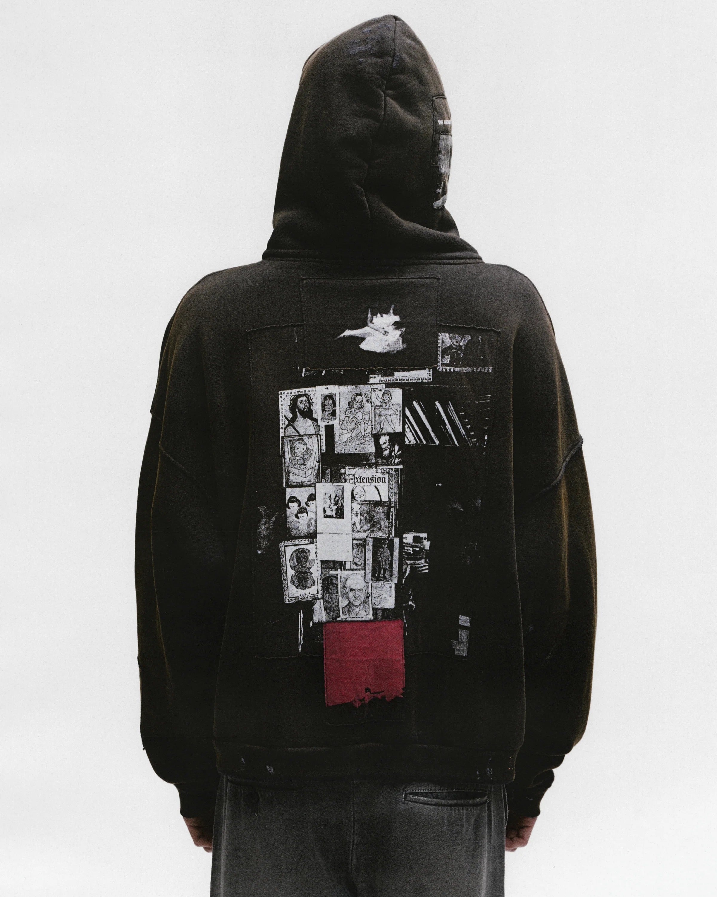 Black hoodie worn by a person, showing the hoodie