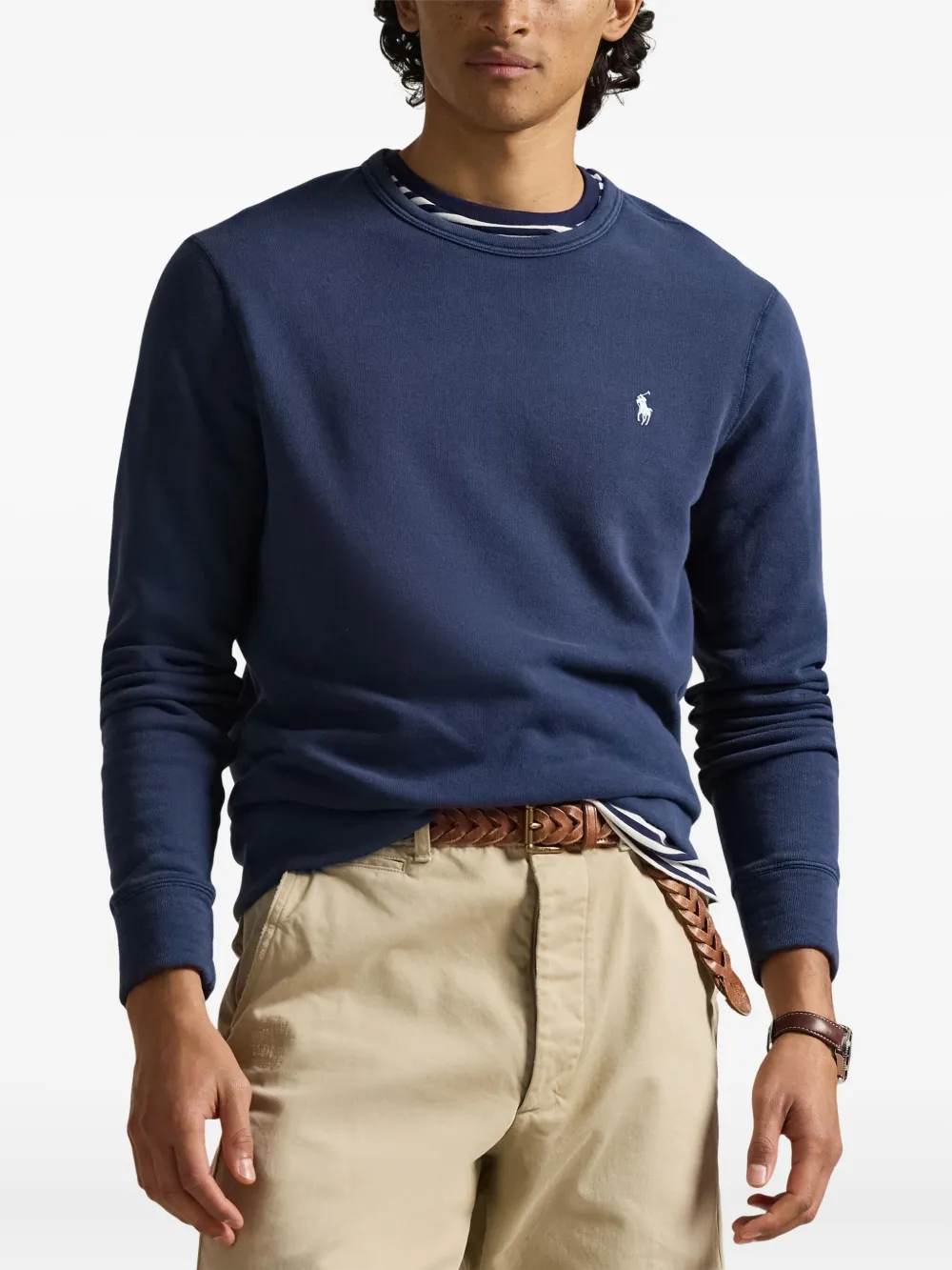 Blue sweatshirt worn by a person, showing the sweatshirt's  fit