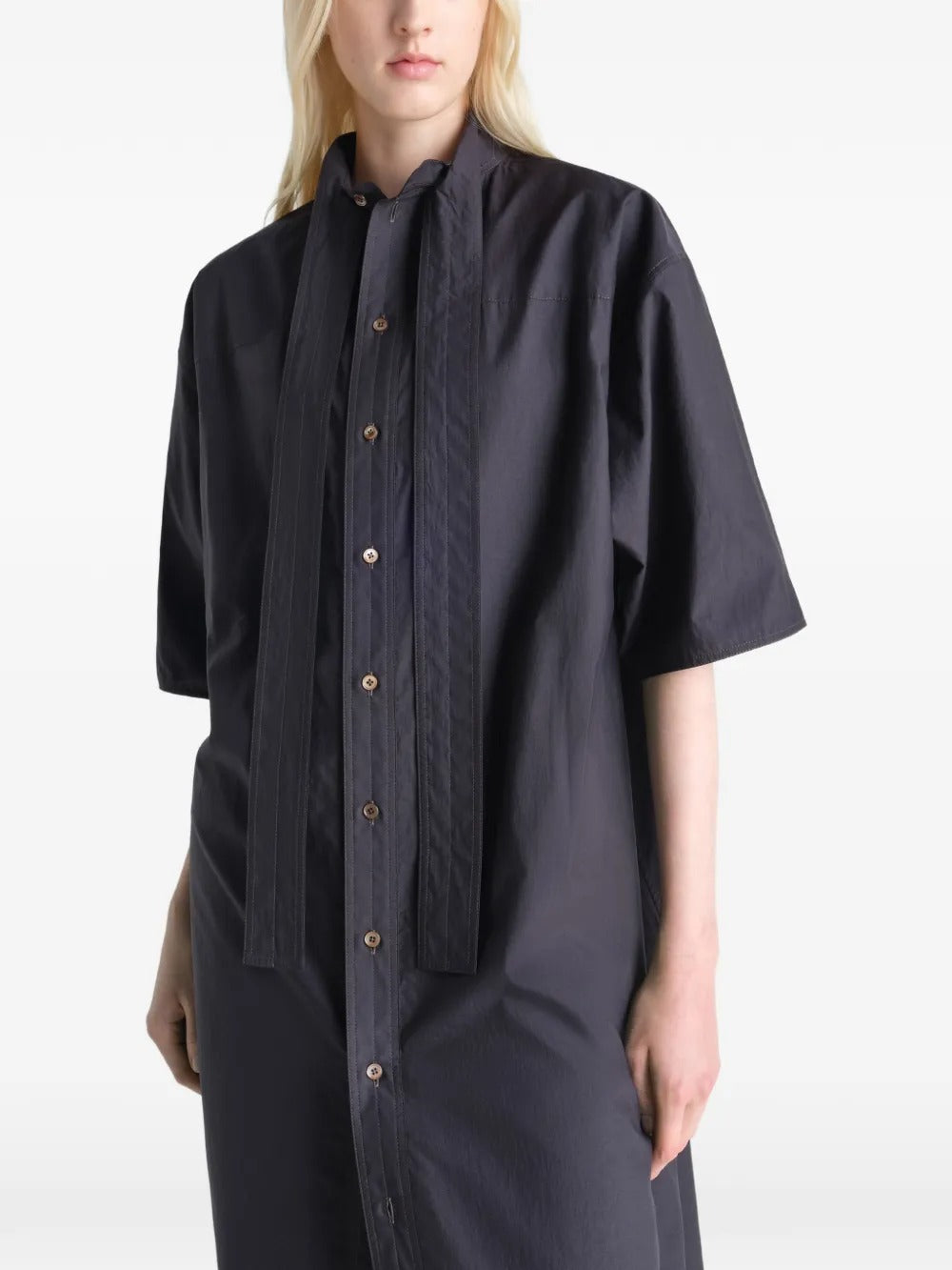 Black dresses worn by a person, showing the dresses fit