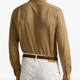 Brown shirt worn by a person, showing the shirt's fit