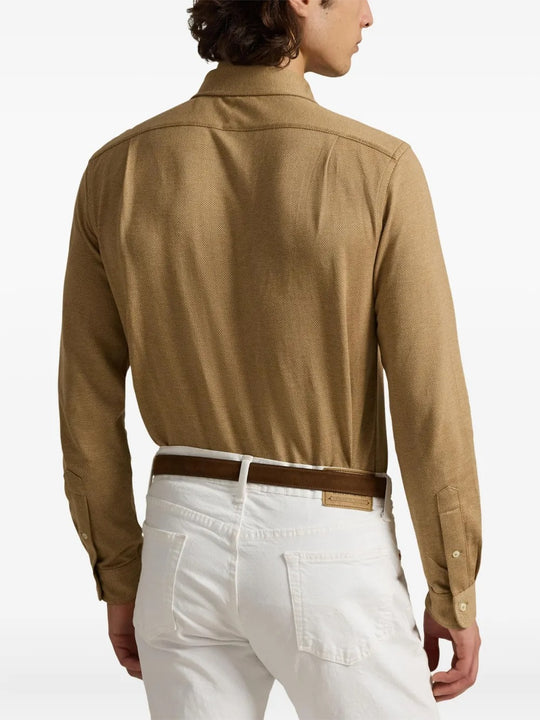 Brown shirt worn by a person, showing the shirt's fit
