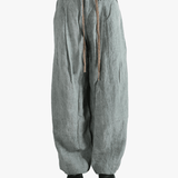 Gray pants worn by a person, showing the pants fit
