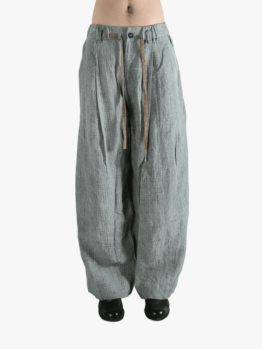 Gray pants worn by a person, showing the pants fit