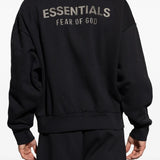 Black sweatshirt worn by a person, showing the sweatshirt's fit