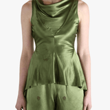 Green tops worn by a person, showing the tops fit