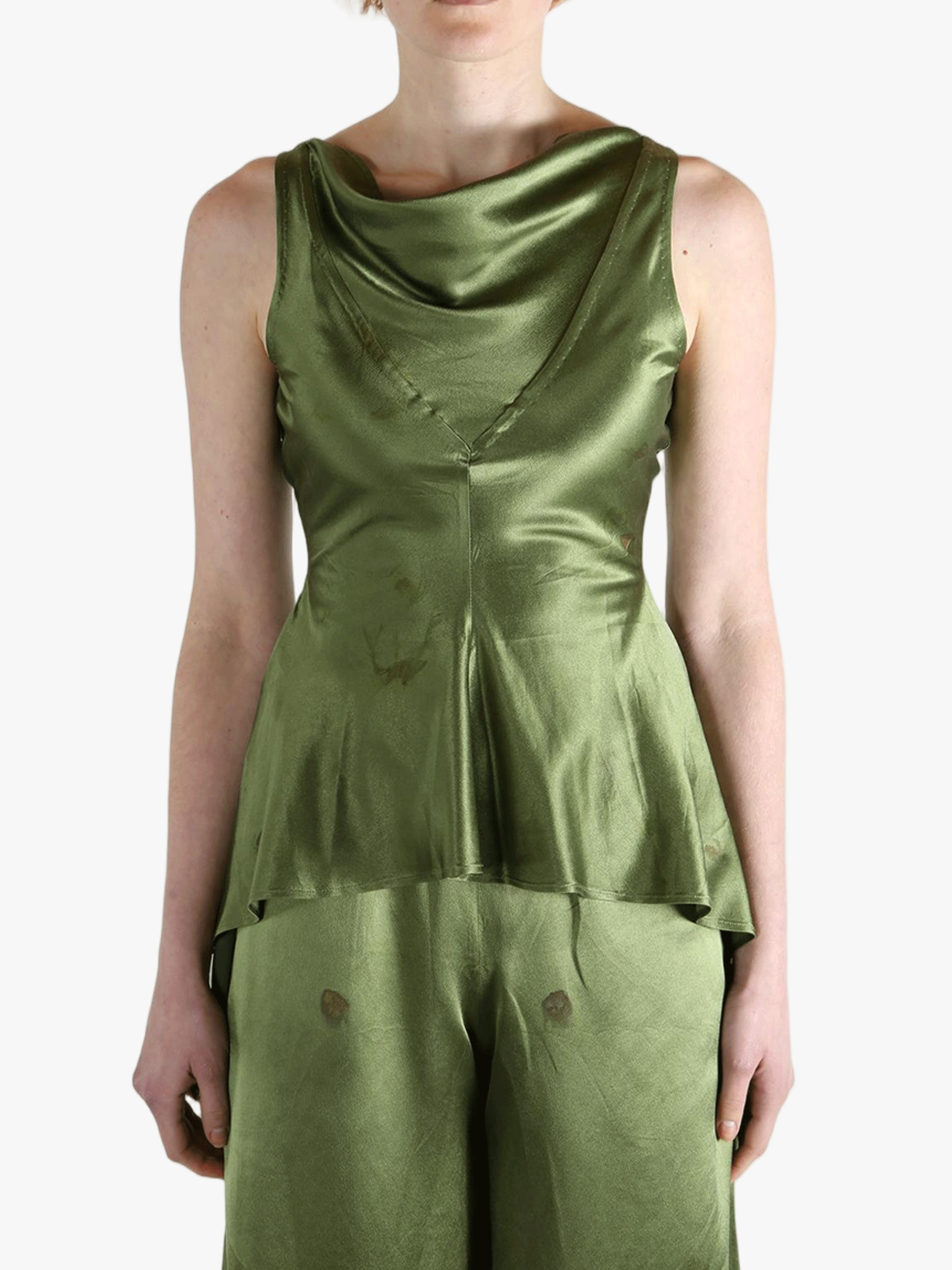 Green tops worn by a person, showing the tops fit