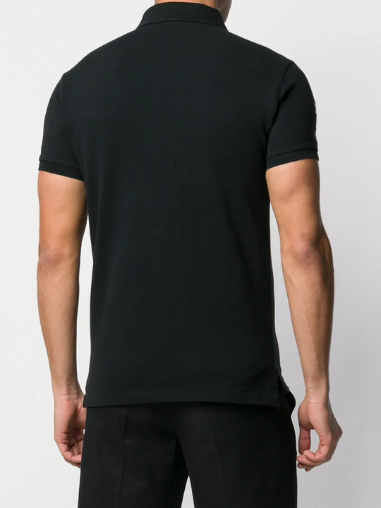 Black shirts worn by a person, showing the shirts fit