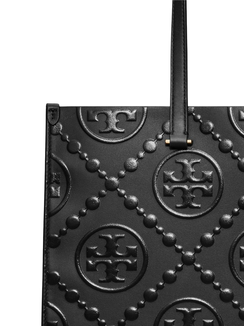Close up of black bags, showing texture of leather fabric