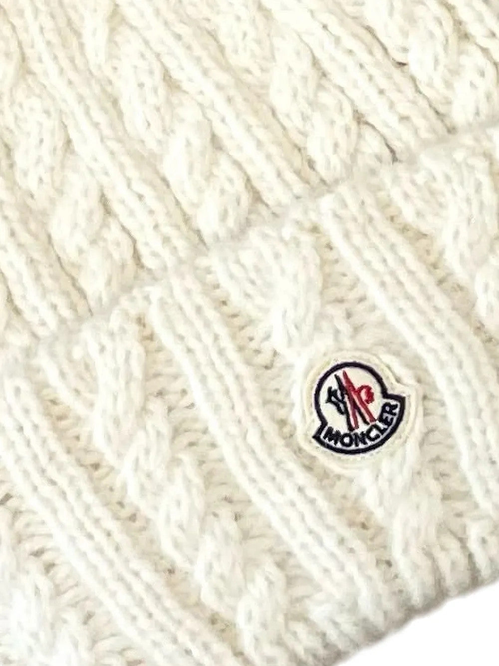 Close up of White hat, showing texture of the 43% alpaca/ 36% polyamide/ 21% wool fabric