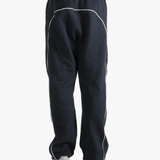 Black pants worn by a person, showing the pants fit