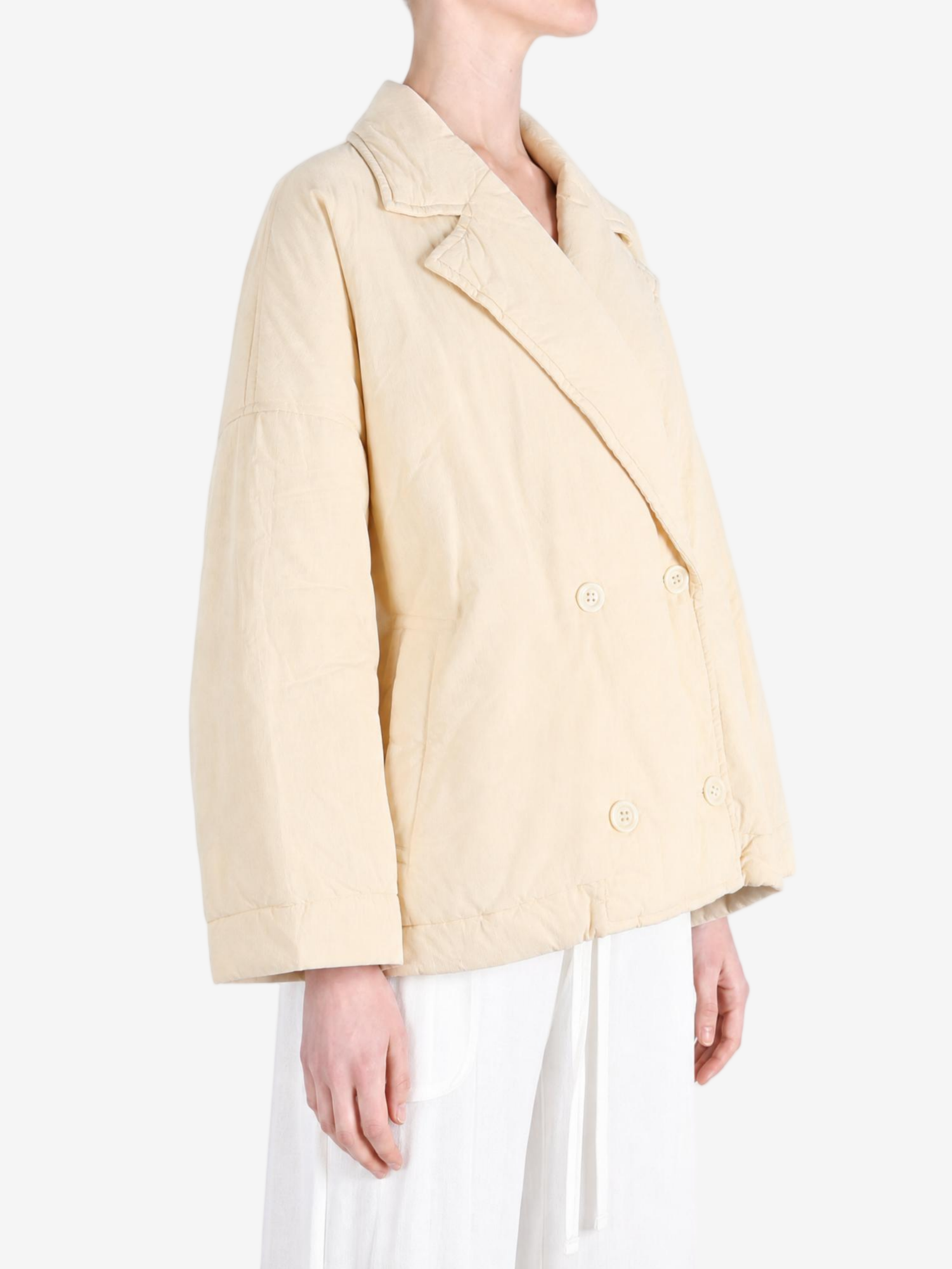 Tan jacket worn by a person, showing the jacket fit