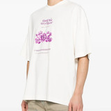 tan t-shirt worn by a person, showing the t-shirt fit