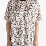 Tan t-shirts worn by a person, showing the t-shirts fit