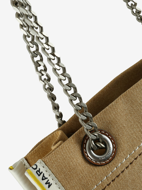 Close up of tan bag, showing texture of the cotton fabric