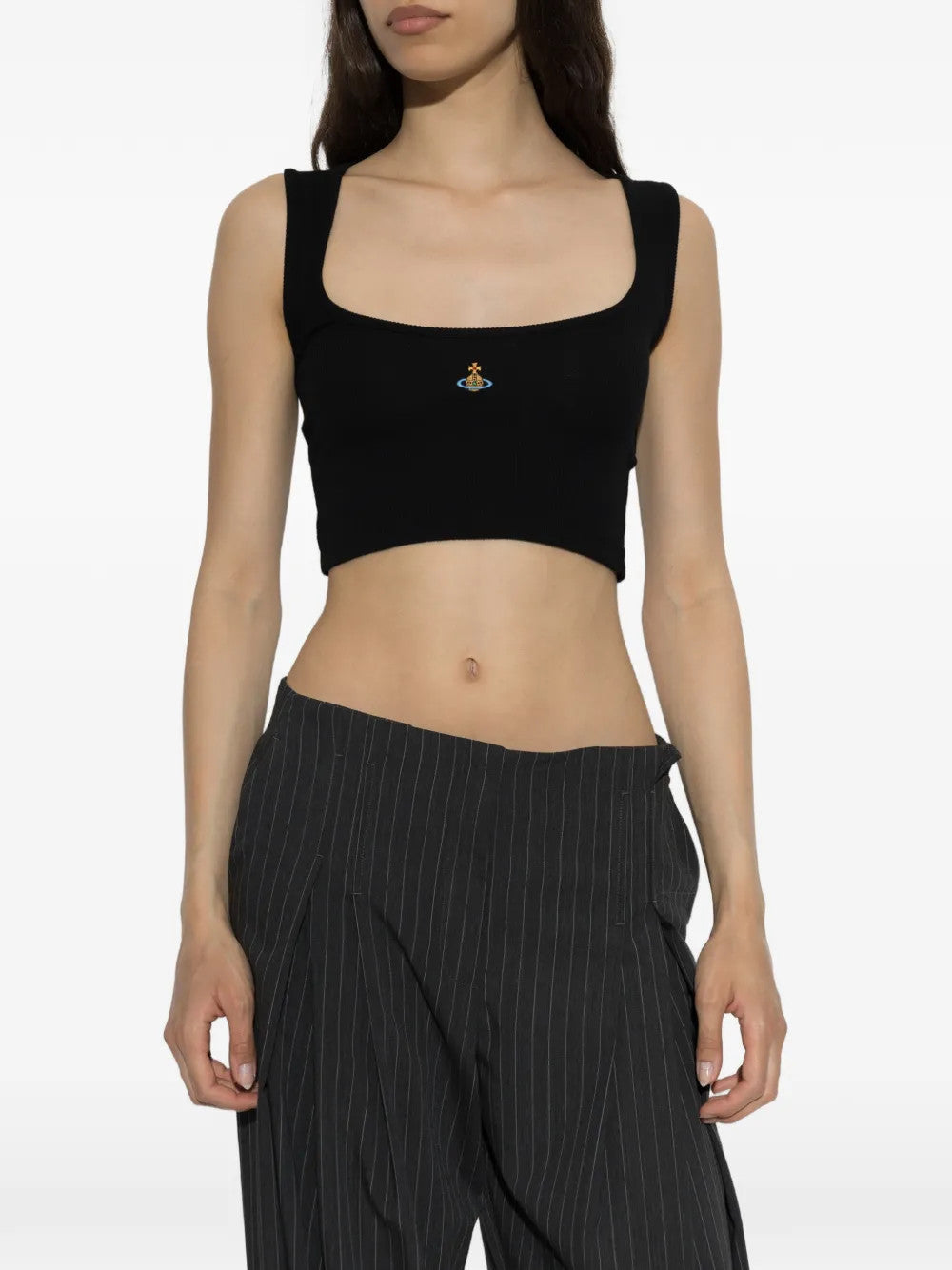 Black top worn by a person, showing the top fit