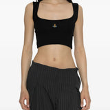 Black top worn by a person, showing the top fit