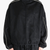 Black jacket worn by a person, showing the jacket's fit