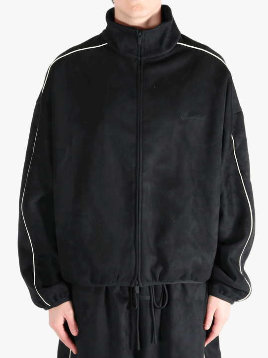 Black jacket worn by a person, showing the jacket's fit