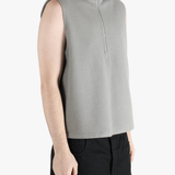 Grey top worn by a person, showing the top's fit