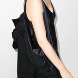 Close up of black jackets, showing texture of the polyester fabric