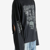 Black shirt worn by a person, showing the shirt fit