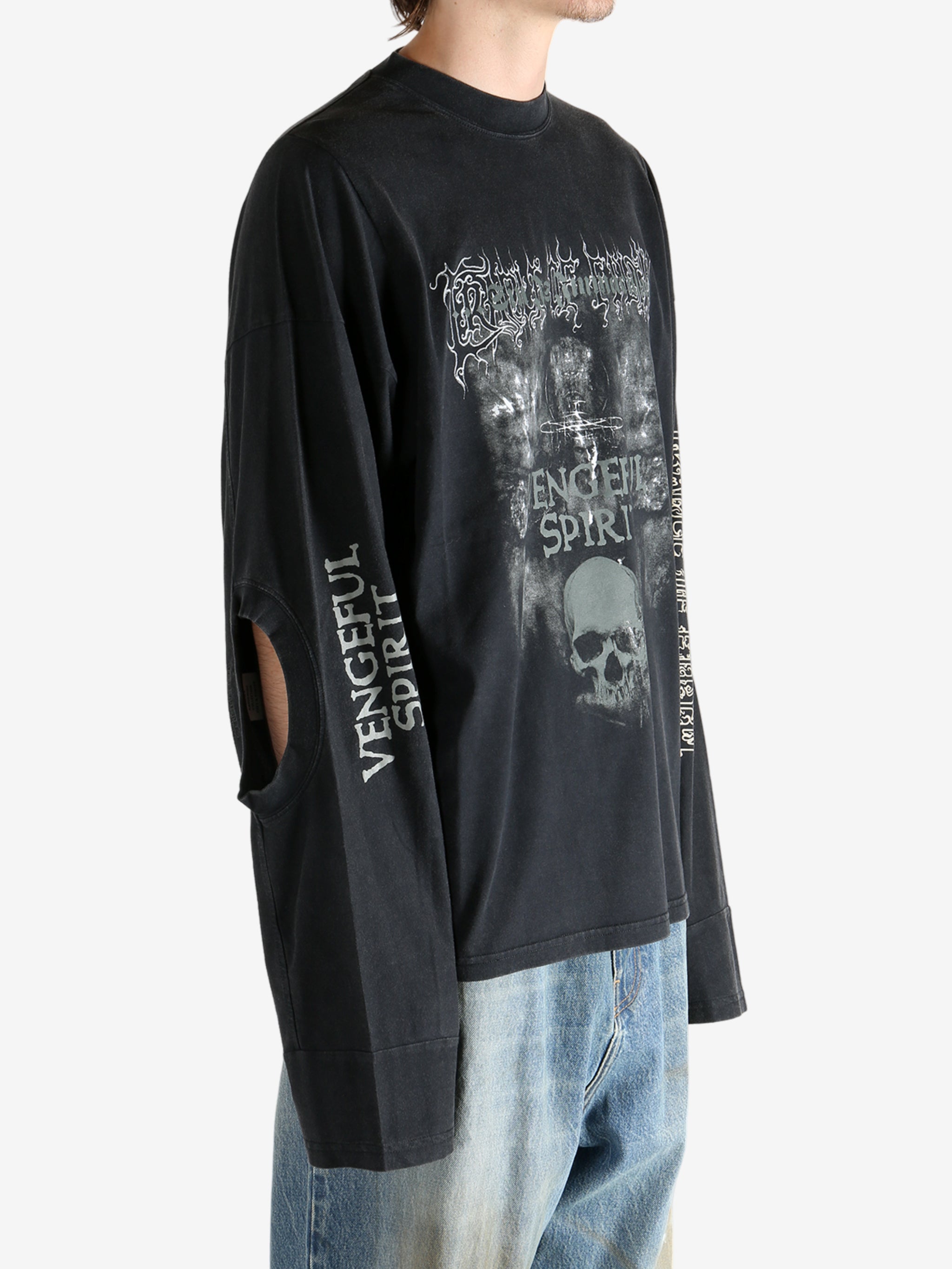 Black shirt worn by a person, showing the shirt fit