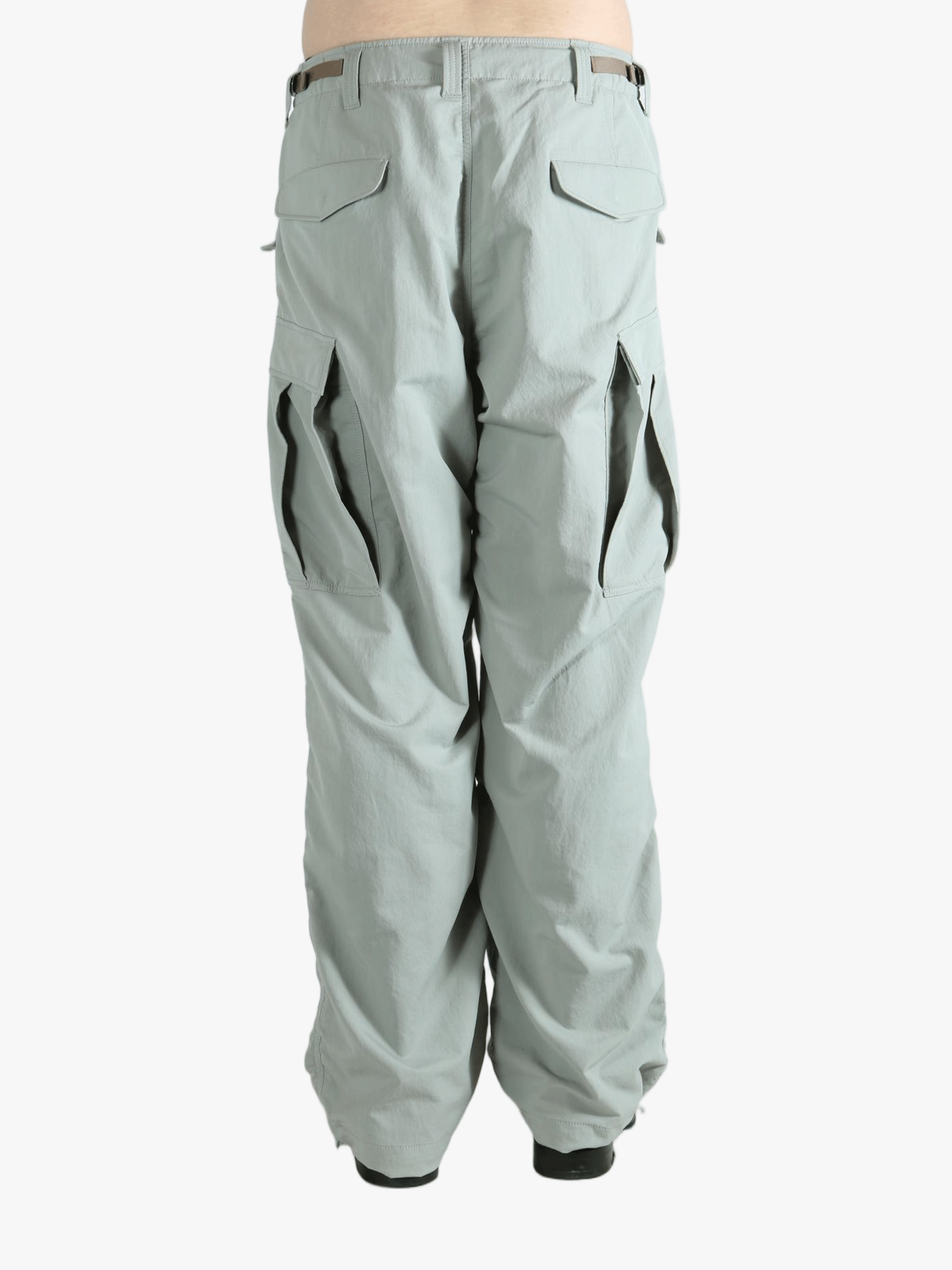 Grey pant worn by a person, showing the pant's fit