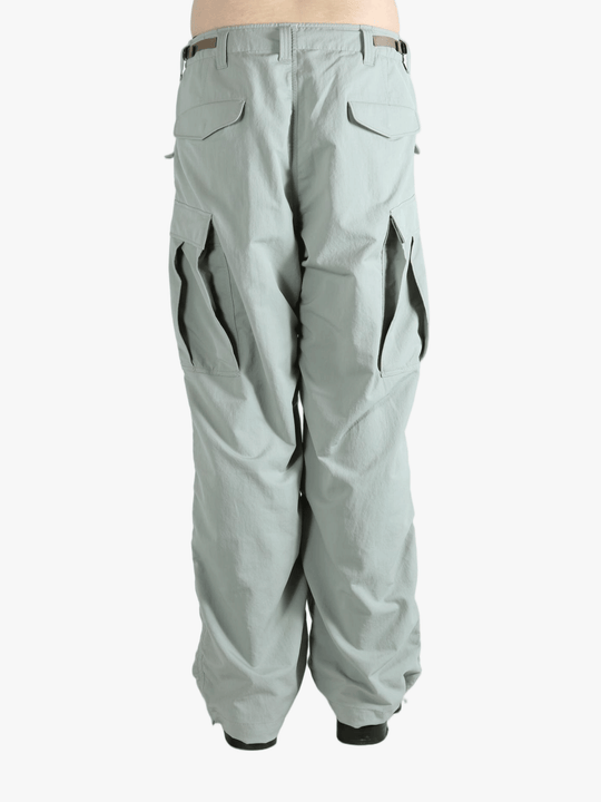 Grey pant worn by a person, showing the pant's fit