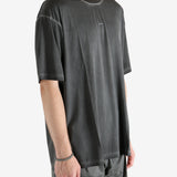 Black t-shirt worn by a person, showing the t-shirt fit