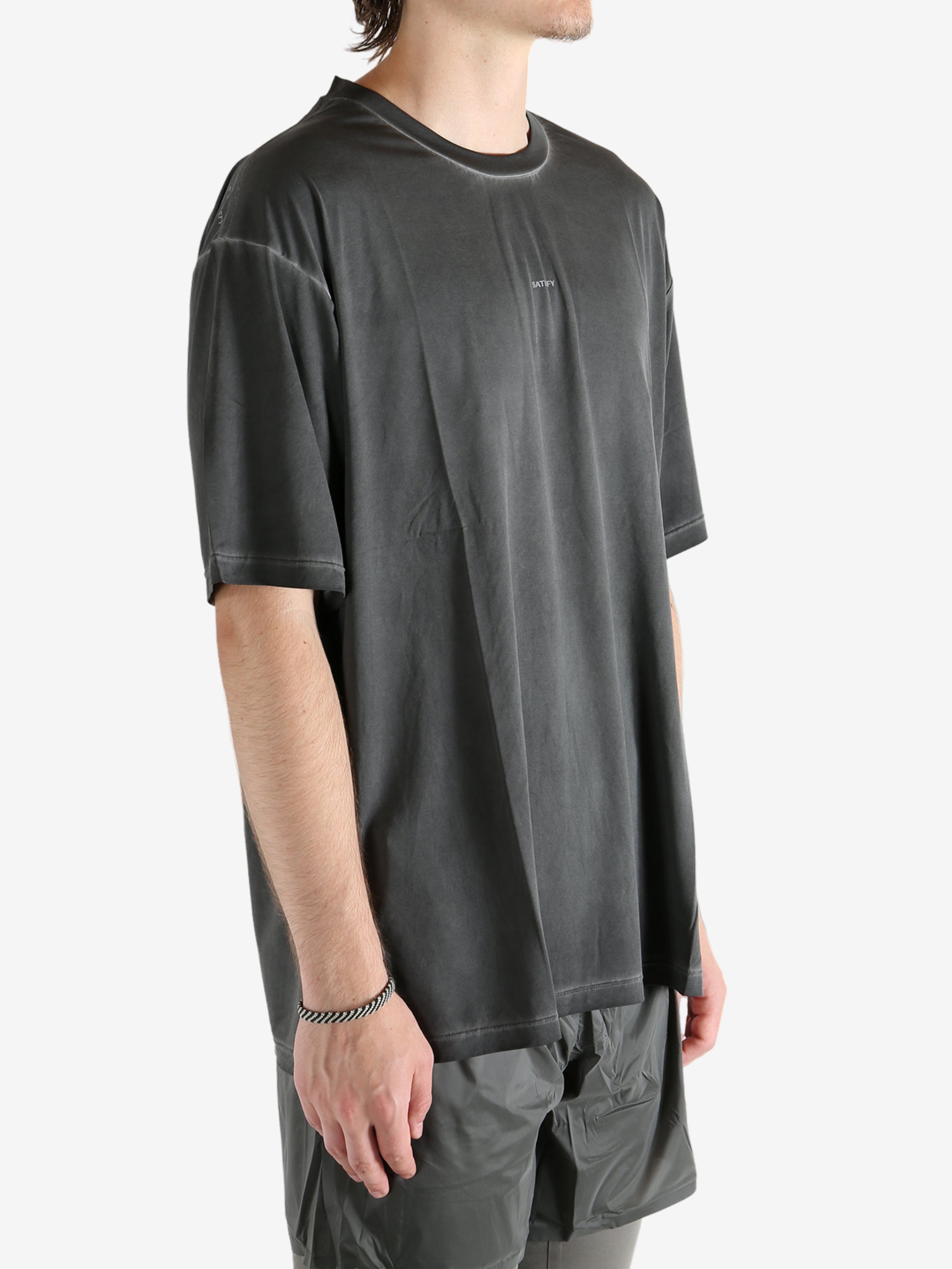 Black t-shirt worn by a person, showing the t-shirt fit