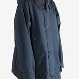 Navy jacket worn by a person, showing the jacket's fit