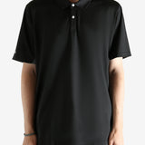 Black shirt worn by a person, showing the shirt's fit