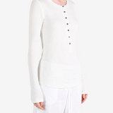White shirt worn by a person, showing the shirt fit