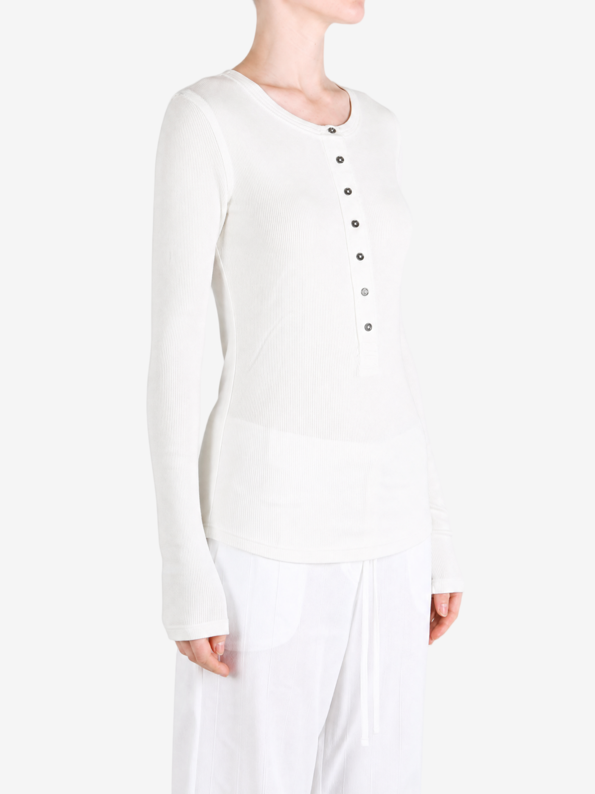 White shirt worn by a person, showing the shirt fit