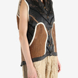 Black vest worn by a person, showing the vest fit