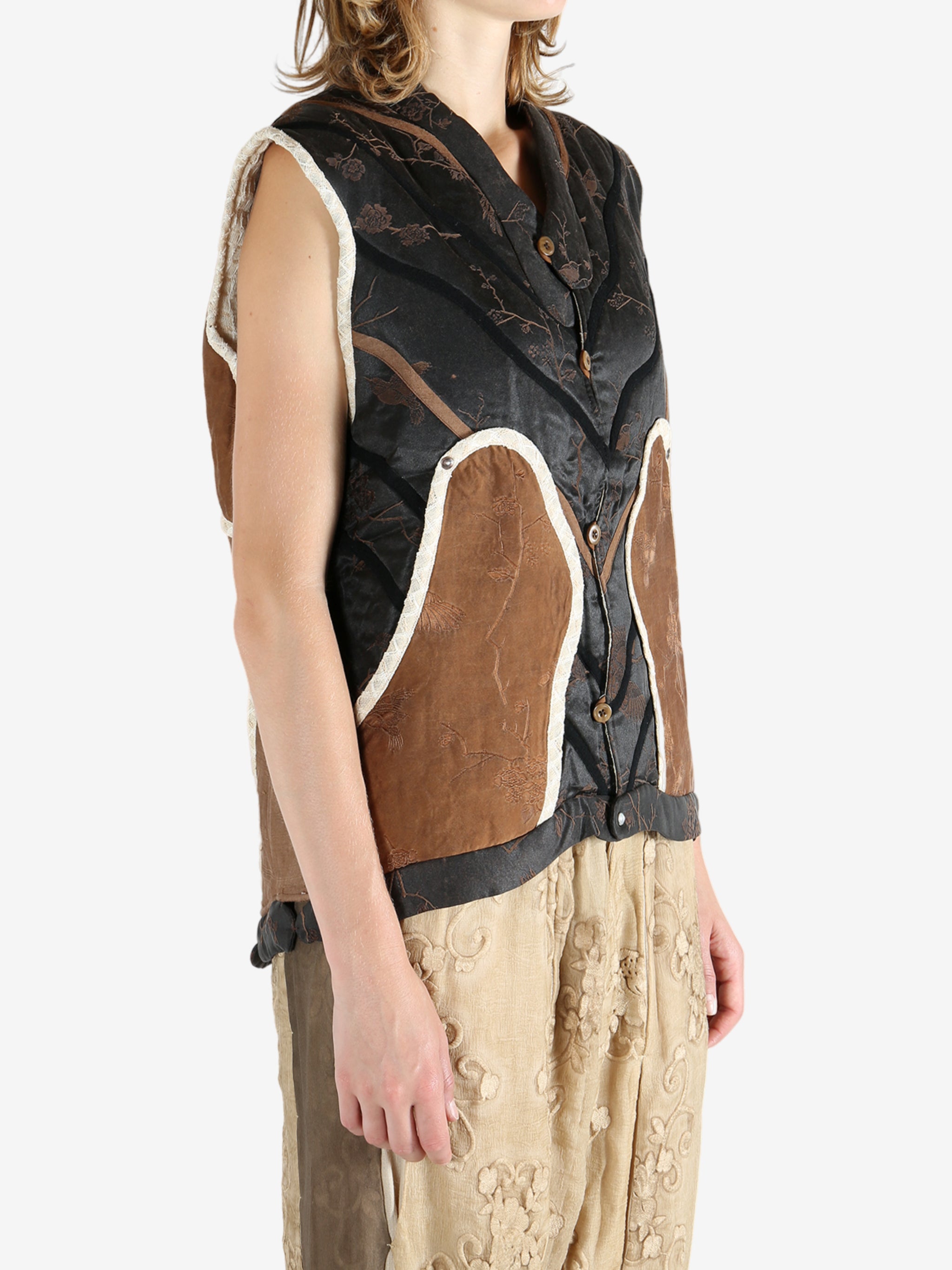 Black vest worn by a person, showing the vest fit