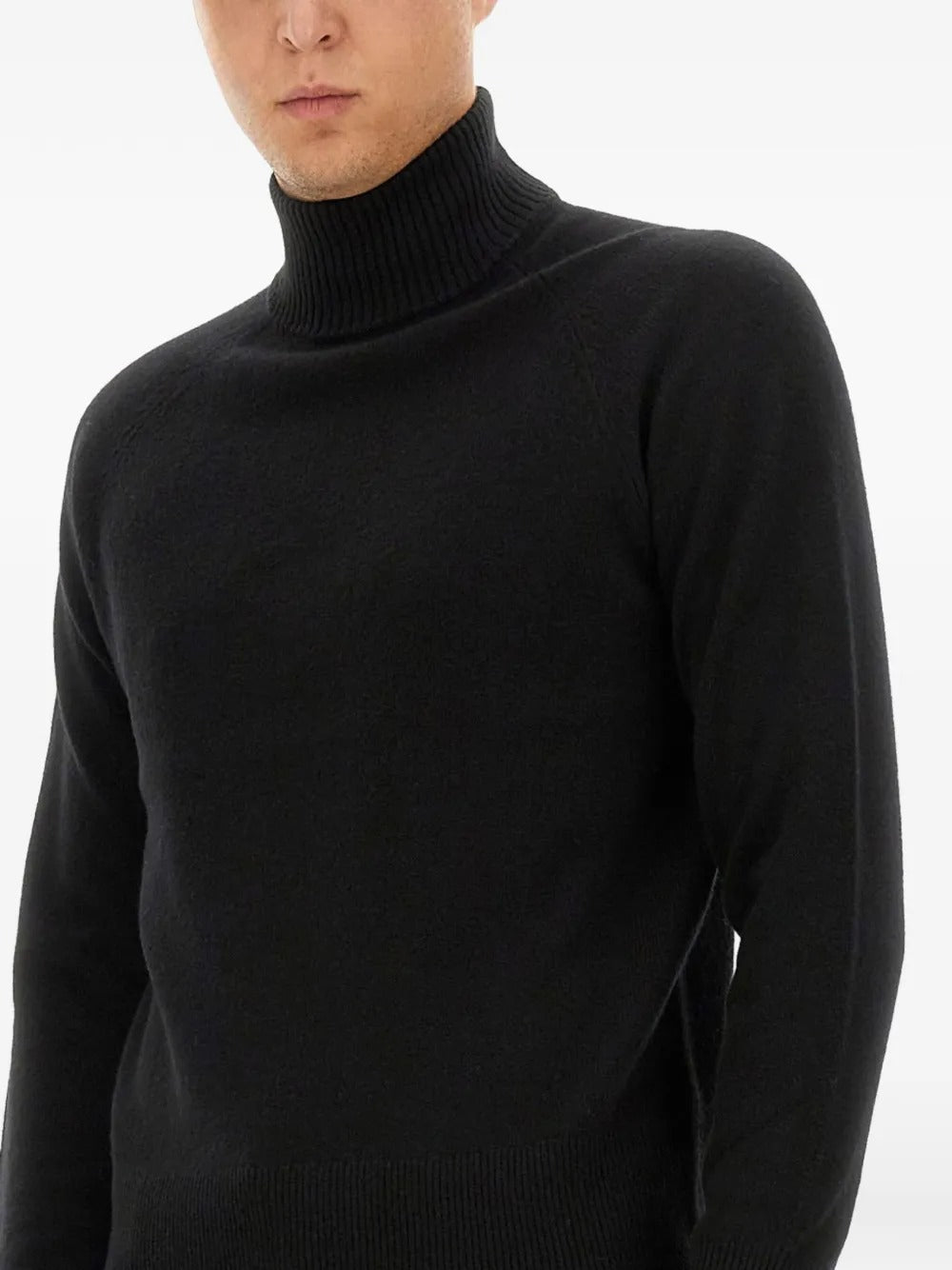 Close up of black knitwear, showing texture of the viscose fabric