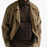 Brown bag worn by a person, showing the bag fit