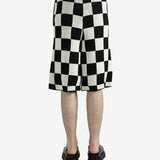 Black shorts worn by a person, showing the shorts’ fit