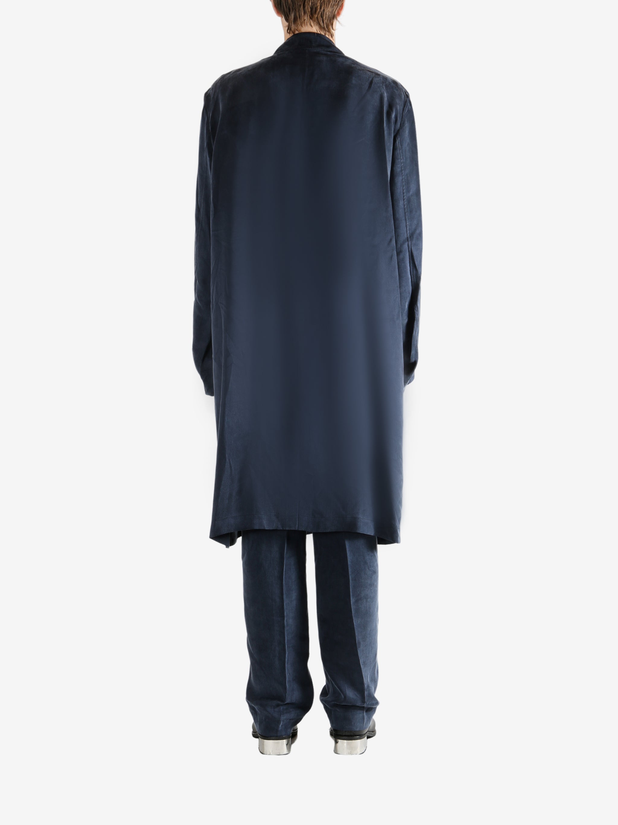 Navy coat worn by a person, showing the coat's fit