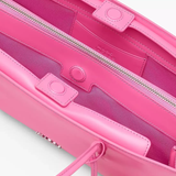 Close up of pink bag, showing texture of the leather fabric