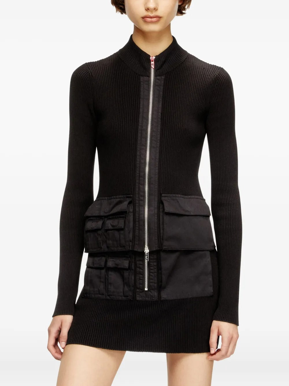 Black knitwear worn by a person, showing the knitwear's fit