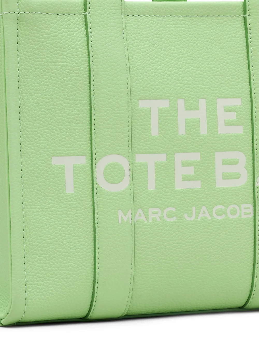 Close up of green bags,showing texture of the leather fabric.